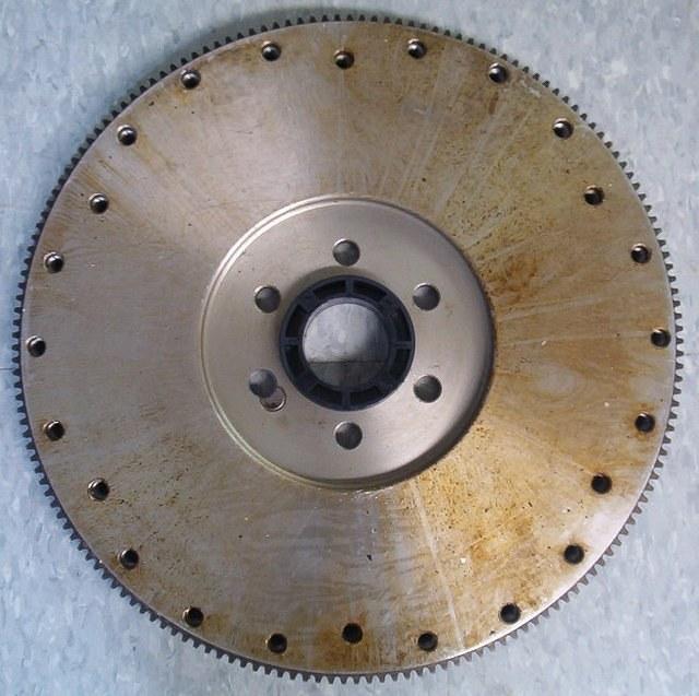 If you are attempting to keep the car as OEM correct as possible then I suggest that we go with an OEM Aluminum Bellhousing and an Aftermarket Steel SFI Flywheel.  That will also keep your feet attached to your legs.