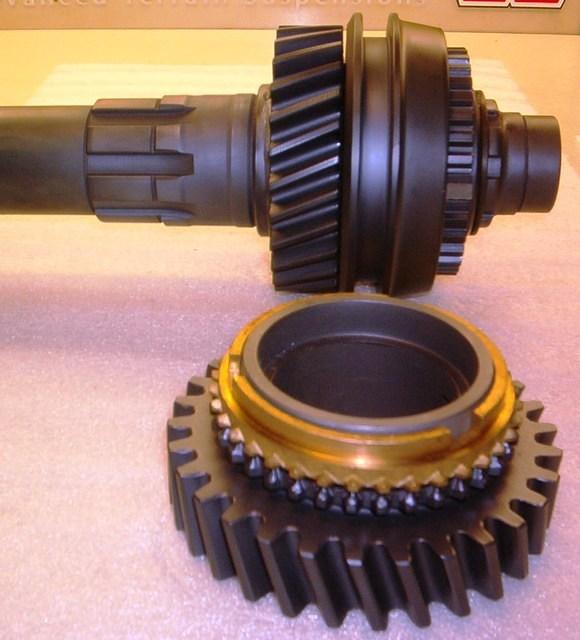 Ok there is the next gear for assembly.  Once again it rides against that flange machined into the Main Shaft.  Grease it up.  Do not forget the Blocker Ring.  They are needed.  Just slide it on.  If it don't fit something is wrong.