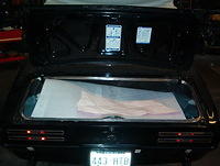 I like to lay down a big peice of carpet foam before I begin to mask the trunk area.