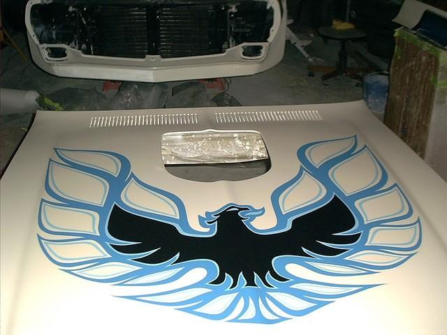 Hood Birdy Application.  What a pain.  Done right the first time of course.  We will be shooting this into clear.  It will really stand out then.