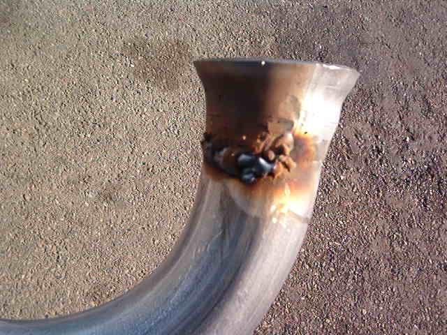 Look at that weld.  Damn Ugly.  You can bet that it will hold though.  I allways over weld the flange to the pipe.  That way I can smooth it out and still have more metal in the area than the pipe has.