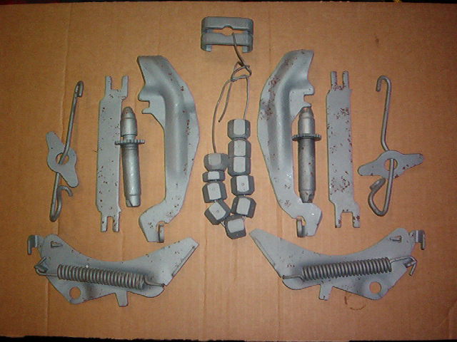 This is the complete package of items that are reused in performing a rear brake system upgrade.  Most of the items are just steel brackets, shims, alignment plates, etc.