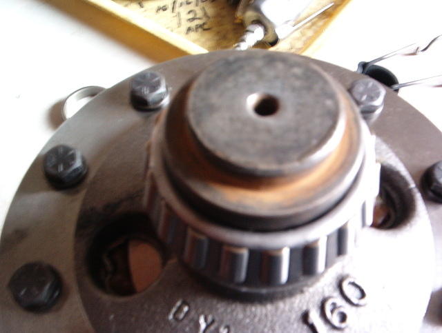 You see using a solid metal "Puck" is great to install correct orientation of the bearing as it is pressed onto the journal.  But once the end is flush with the top of the "Puck" the bearing stops.