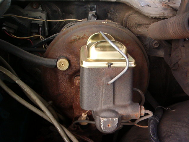 This is the correct master  and power brake booster for this car.  Notice the cap.  Nice Gold Irridate finish.  The booster once looked like this.