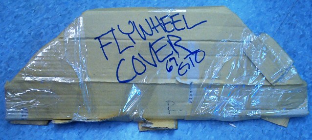 Even the Flywheel cover gets a protective covering with cardboard.  It will keep it from damaging other items.  In this case let us hope that the Semi Tractor does not go Four-Teen Wheeling.