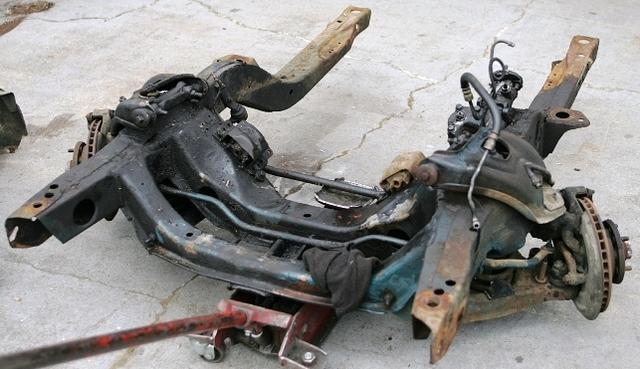 Well here sits the poor back bone of the car.  I will have it up and running in short order.  Lets see, Full Lenght Welding, Cleaning of the welds, Blasting and then Coating.  It will rest easy back in the car.