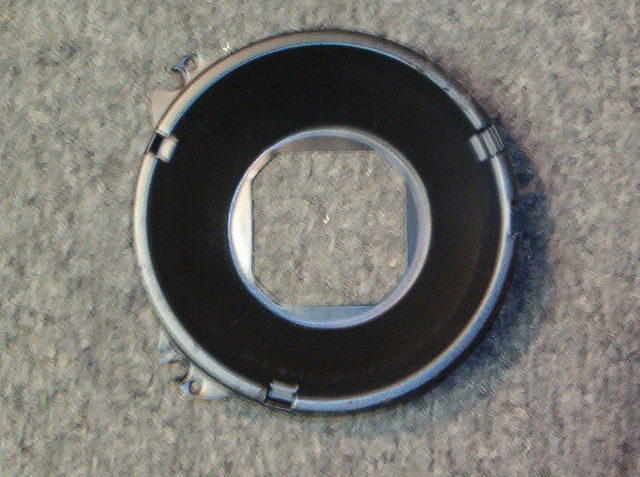 Here you have a top view of the same bucket.  Only 69 Firebird Headlight Buckets have the Square Hole in the back center.  Not only are they Position Specific but the Headlights will not install right side up if you install these incorrectly.  Example ...