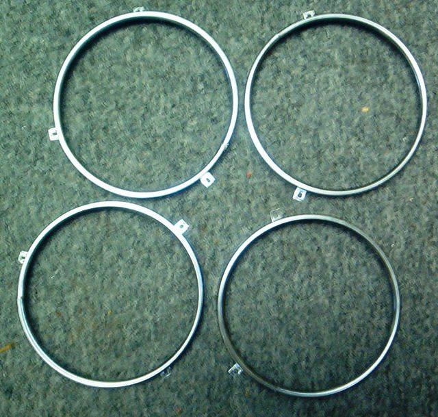 Well here is the complete set of the Headlight Retention Rings.  They are NEW OEM peices and the only way to go for a Top Notch Restoration.  Line number 23
