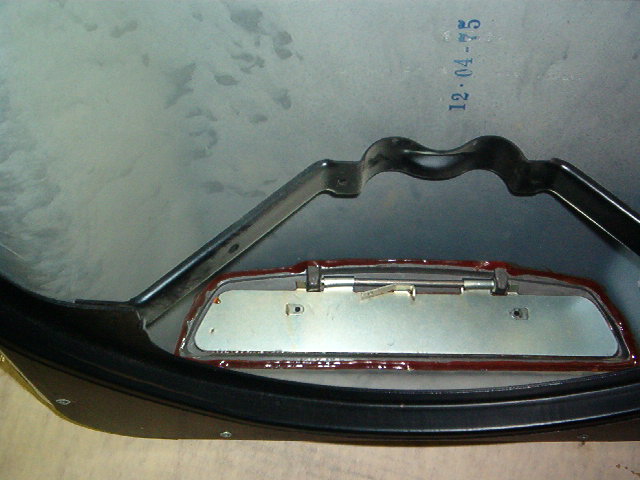 You will notice in the NOS OEM 1971 to 1972 shaker here the degree of the adhesive that General Motors used to retain the frame and flap.  Quite a bit, not easy to get off.