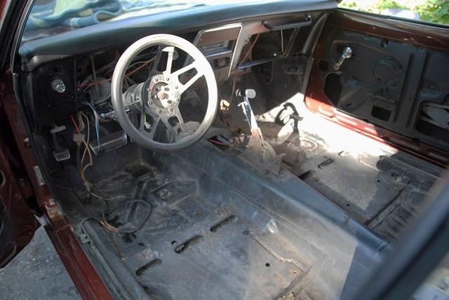 This was how we found her inside the interior was gone and ended up in a Camaro. The floors are orinal no rust except where the seats bolted on. The wire butchered and crapy B&M shifter had to go.