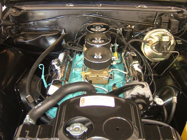 Here sits the completed Tri Power installed into the engine compartment.  It sure looks good.  Notice the correctly plated Master Cylinder Booster.  All and all a good job.