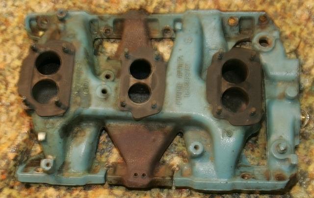 Here it is.  Yes this is the Ugly intake that was on his car.  I have the technology to return it to the pristine shape that it was when new.  Just wait and see.  I am the Tri Power man.