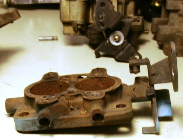 There are many small items of design that indicate that this is the correct base for a 65 Center Carburetor.  You will notice that there are two Air Fuel adjusting screw ports in the front of the Ventury Base.