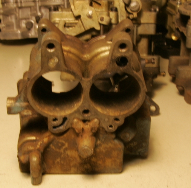 Here is the bottom of the main body casting.  You can see from this picture that there is no Air Bypass Valve.  The older carburetors are quite obvious due to this.  Now some will tell you that they are correct for Automatic Cars.
