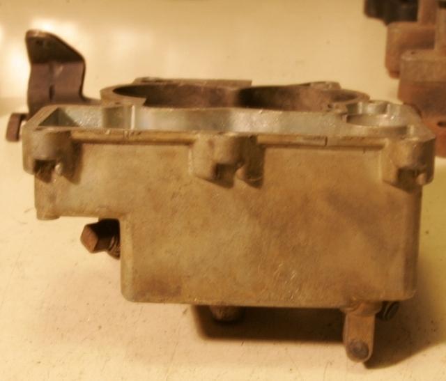 Looking at the front of the carb there is no visible difference. You will see that the Main Bodys appear the same from the front view.  Produced by Rochester Carburetors they are pretty much of the same design.