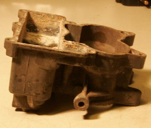 I will have this Main Body looking OEM NOS.  It will take about two weeks in the unplating tank.  All the corrosion, plating and etc will be electrchemically sucked off the main body.