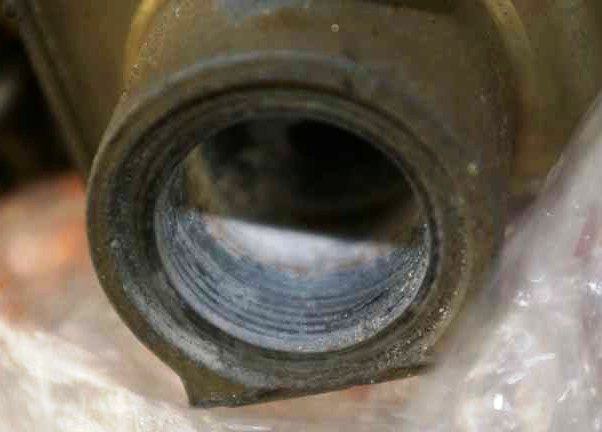 Here you can see the electrolytic corrosion that can take place between the two different metals that make up the carburetor main body and the inlet fitting.  This can make for a nasty condition which results in Stripped Threads.