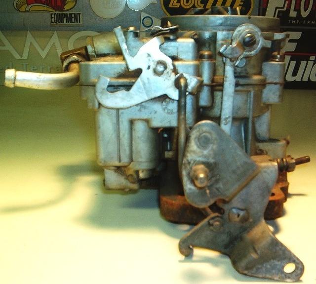 Here is a very unique Tri Power Carburetor that I found on a GTO.  Wrong Fuel line from the factory, wrong accelerator belcrank, wrong what else?  Or is it correct?  Pay attention to the OEM appearance of the linkage.