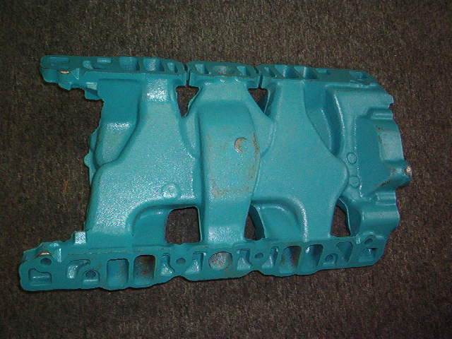 These pictures are of the correct 64 Tri Power Intake Manifold that you will need.  If you want I can also sell you the correct 64 Intake Manifold with the Tri Power.