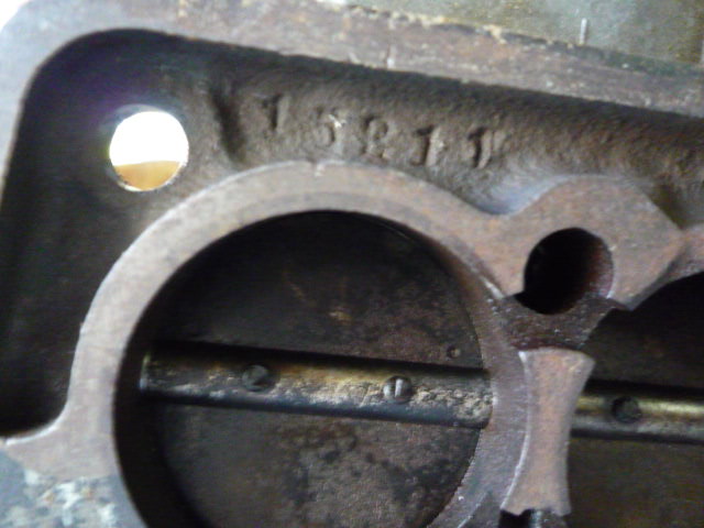 Here is another part number stamped into the lower Throttle Valve Base Plate.  It can also be useful to identify the type of Base Plate and the year of the carb.  Notice the ruined throttle shaft.