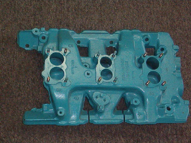 We have taken this manifold down to absolutely nothing.  All fasteners have been removed.  All the threaded holes have been taped, the manifold hot tanked and then shake and baked.  Once I finally had an OEM appearing NOS manifold I checked it for cracks.