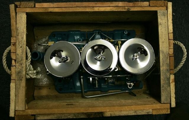 There were many items that needed to be changed when you installed a 65 Tri Power.  The Throttle Cable Bracket, The Valley Pan, Attaching Hardware, and other items.  They all fit in the crate.