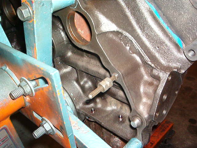You will notice that I have installed a stud and placed a solid steel bushing over it.  This is the famous Snap On Broken Stud Puller.  It has this Funky Splined Shaft and a special drill.  You drill the hole and pound in this shaft.