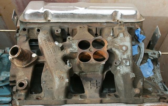 Well this is the top view of a Carter OEM Cast Iron Goat Intake Manifold.  Now you will notice all the OEM items that are still intact and installed.  I love pictures of such.