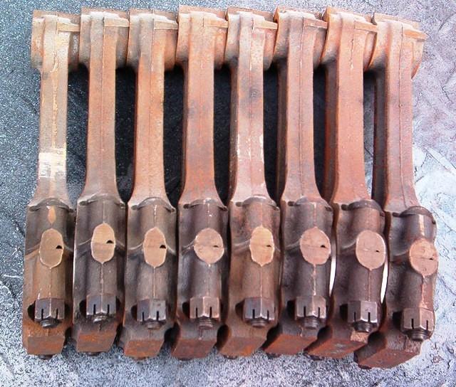 This is your early set of OEM Cast Iron Pontiac Rods.  I do not see these Castelated Rod Nuts very often.  Mater of fact I do not remember seeing a set on connecting rods like this before.  Probably some mechanic thinking they looked cool.