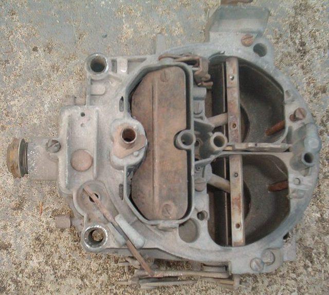 Here is the beautiful carb.  I just love to get a carb that is in this shape.  Nearly every part necessary to make it a carburetor is gone.  No Secondary Metering Plates.  No Choke Mechanism, no throttle linkage, incorrect part number main body.  What ...