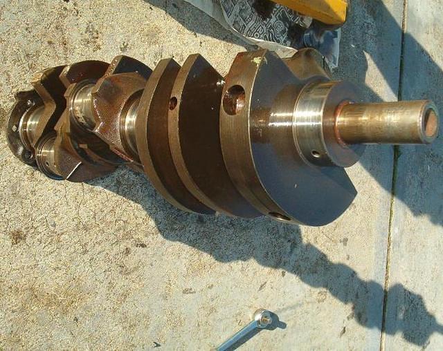 Here is the old crankshaft.  Quite undersize when it went in.  Now with the damage to the rods and mains it is metal man material.  NO worry though.  It was not anything rare or hard to find.  Just a shame to see it damaged this way.
