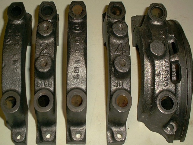 Most Pontiac motors had only two bolt main caps.  These were the failure prone cap sets.  You can see that they are all held on by two bolts.  Just imagine that big four foot long piece of cast iron spinning around at 6000 rpm held in by 10 bolts.