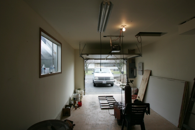 When I was done with the sheet rock, Oak moldings, paint and the like the garage was definately the best room in his whole house.  On top of that it was clean with a concrete floor.