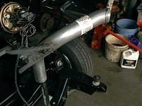 Hay like my nice ground lug that I welded onto the rear tail pipe?  It might even be able to support the exhaust pipe.