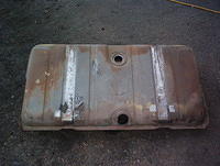 Here you have a great condition gas tank.  Any dumpster divers need a good gas tank?  I got several waiting for your car.  Let me know.