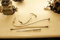 In all cases where I can save a buck and still hit the 90% value level I may consider a next best item.  In the case of the fuel lines, Linkage and etc NO WAY.  I make them myself.  His Linkage Rods had been modified by some back yard mechanic into Hei...