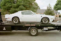 This tilt bed lets the car down easy.  No need to drag it along behind the truck.  We let them rest and watch the scenery.