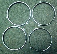 Well here is the complete set of the Headlight Retention Rings.  They are NEW OEM peices and the only way to go for a Top Notch Restoration.  Line number 23