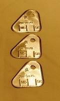 These are the infamous front upper air horn carb tags.  They are individually numbered and located due to postion.  There are other ways to determine that the carburetors are original items but these are the easiest.