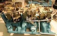 Notice that the rear carb to center carb linkage rod is installed on the outside.  That is not the way they came from the factory.  Many setups are assembled like this.  Of course they would not of bent the back carb rod the way it was if this was corr...