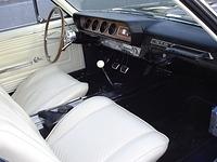 Damn nice interior.  Looks quite white.  Nice GTO sissy grab bar, four speed, wood wheel, hope that I can talk him into getting the correct Rally Dash with the OEM Factory Guages in the future.