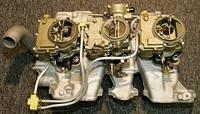 Matter of fact I do not like that top on the middle carburetor either.  It is a latter one.  At the time I did not have the early top.  They are damn hard to find in a great shape.  Those old timers would just screw in the fittings until they stopped l...