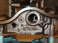 Here you will notice the factory numbers cast into the block.  You will also notice the other oil galley plug removed.  Go ahead remove this plug.  I have found a finger's worth of sludge behind these before.