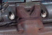 Here is a larger view of the surrounding location of the center two Spark Plugs and the location of the two Married Exhaust Ports.  This is a Casting Number "16" non Ram Air Head.  Notice the log manifolds.