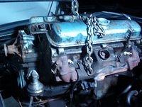 Here you go.  Chain on and motor ready to remove.  I like to leave the hard to remove objects on the motor.  Sometimes you can remove them later when the engine is out and the area to work is better.