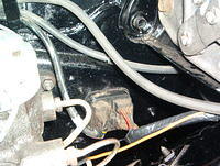 Here is the wire that they left off.  The Brown Wire going to the Brake Block.  I was installing it onto the switch.  In the process I moved the Firewall Wiring Harness and it smoked.  The wire melted up to the Voltage Regulator.  The Fenderwell bolt w...