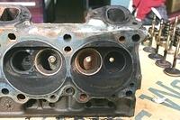 Well the Intake Manifold did not have Water Rust Stains in the ports.  Now this bothers me.  Both of these Intake Valves had obvious Rust.  Not only that but there was no carbon build up on these pistons. Notice the Blue from the Fel-Pro Gaskets?  It's...