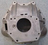 Here is the back side of the bellhousing.  This is where the Transmission bolts up to the bellhousing.  It is held on by four bolts.  They are very important and have to be torqued down to spec.  We will also change the pivot ball that you can see in t...