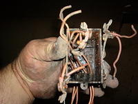 Now here is an example of the box and the fused wires.  Seems to me that they were not broken off during the burning or fireman bash and slash.