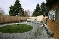 You can really see how misplaced the shed is in reference to the back yard.  It really is a shame.  If the plumbing had not been laid into the ground for the shed I would of rotated it and put the round window in the side wall.